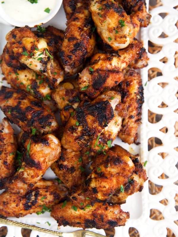 Grilled chicken wings on a white platter