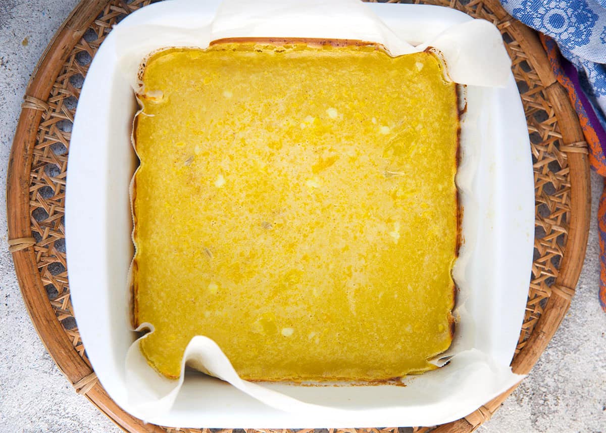 lemon bars in a baking dish after baking