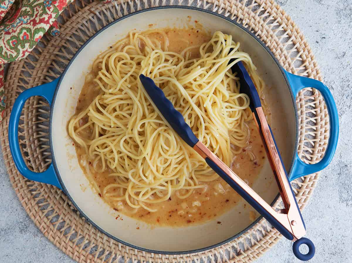miso butter sauce topped with pasta to be tossed together.