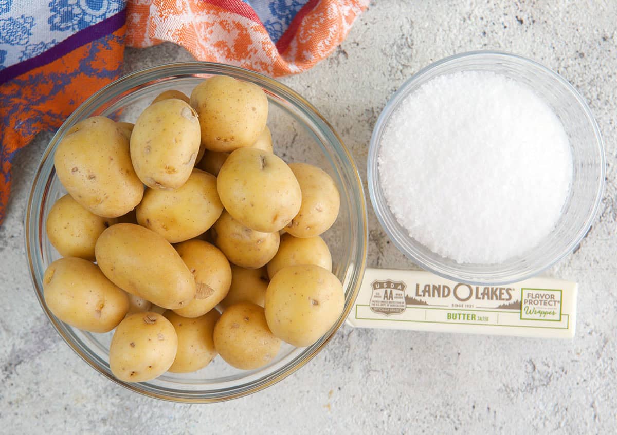 Ingredients for salt potatoes, baby new potatoes, salt and butter