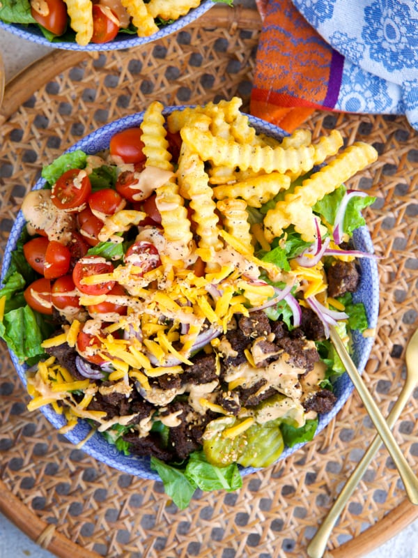 Easy Burger Bowl in a blue and white bowl on a rattan placemat