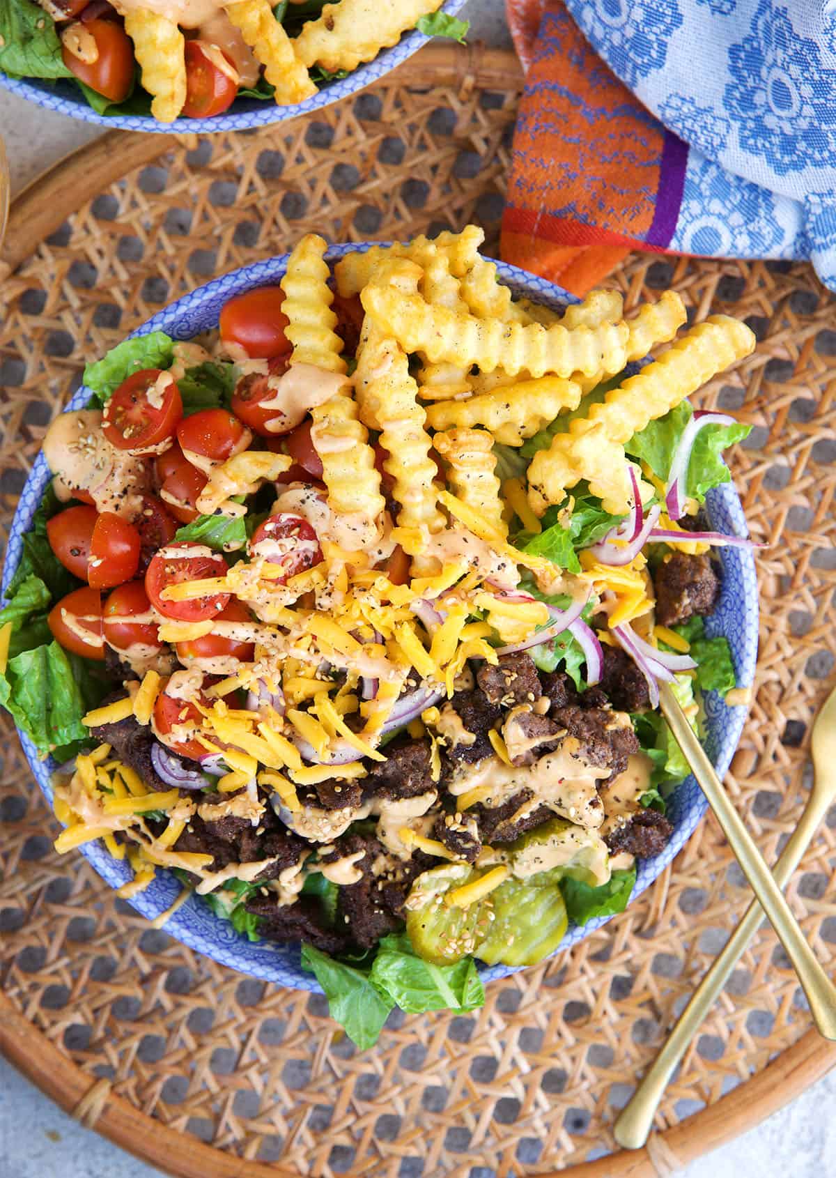 Easy Burger Bowl in a blue and white bowl on a rattan placemat