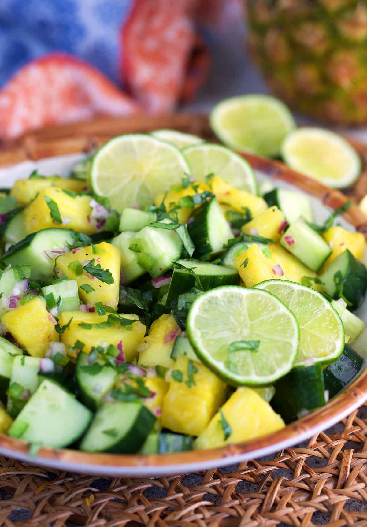 pineapple cucumber salad in a large serving bowl
