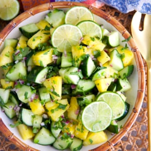 Pineapple Cucumber Salad in a bamboo bowl