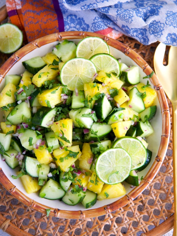 Pineapple Cucumber Salad in a bamboo bowl