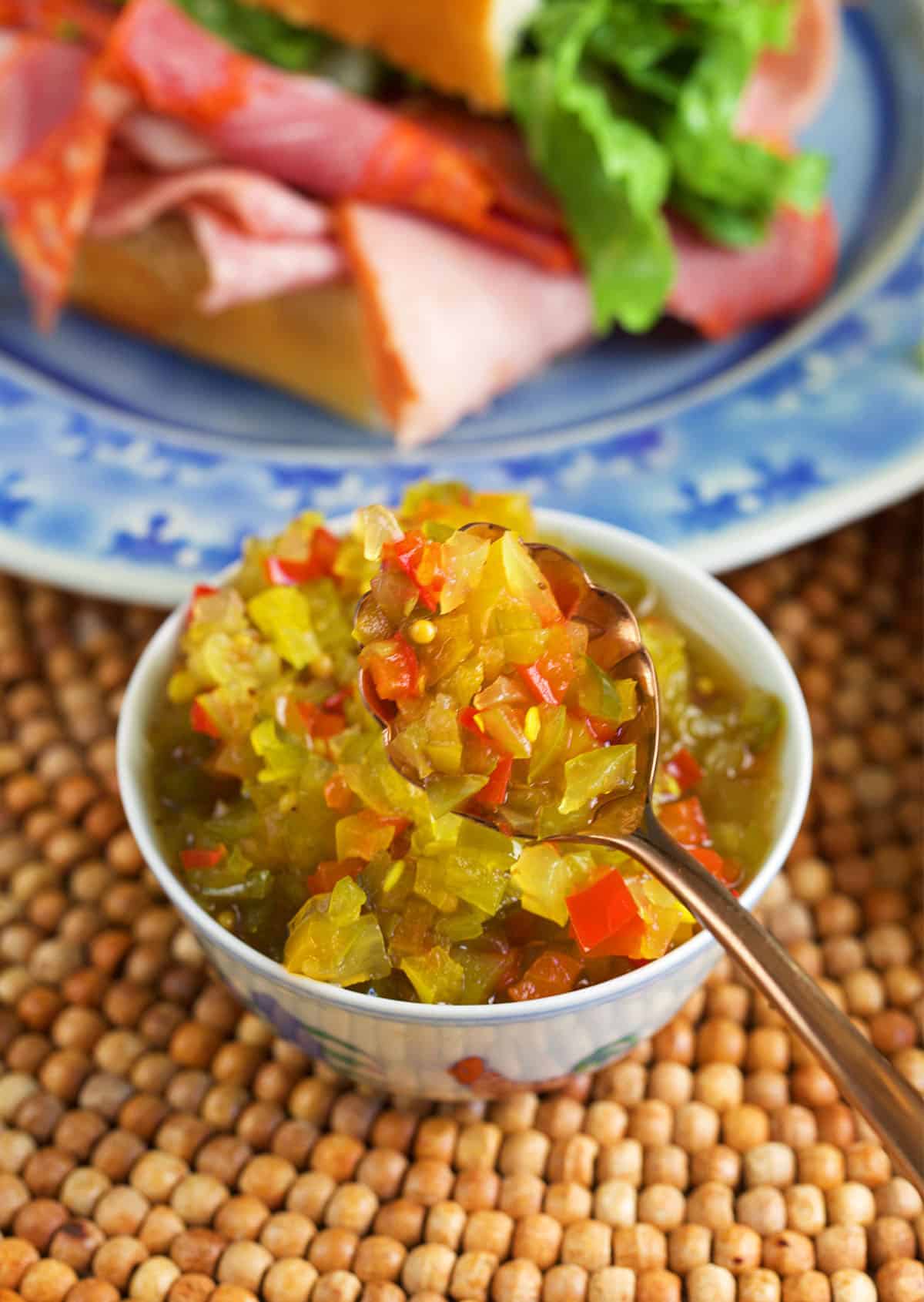 hot pepper relish in a serving bowl with a spoon