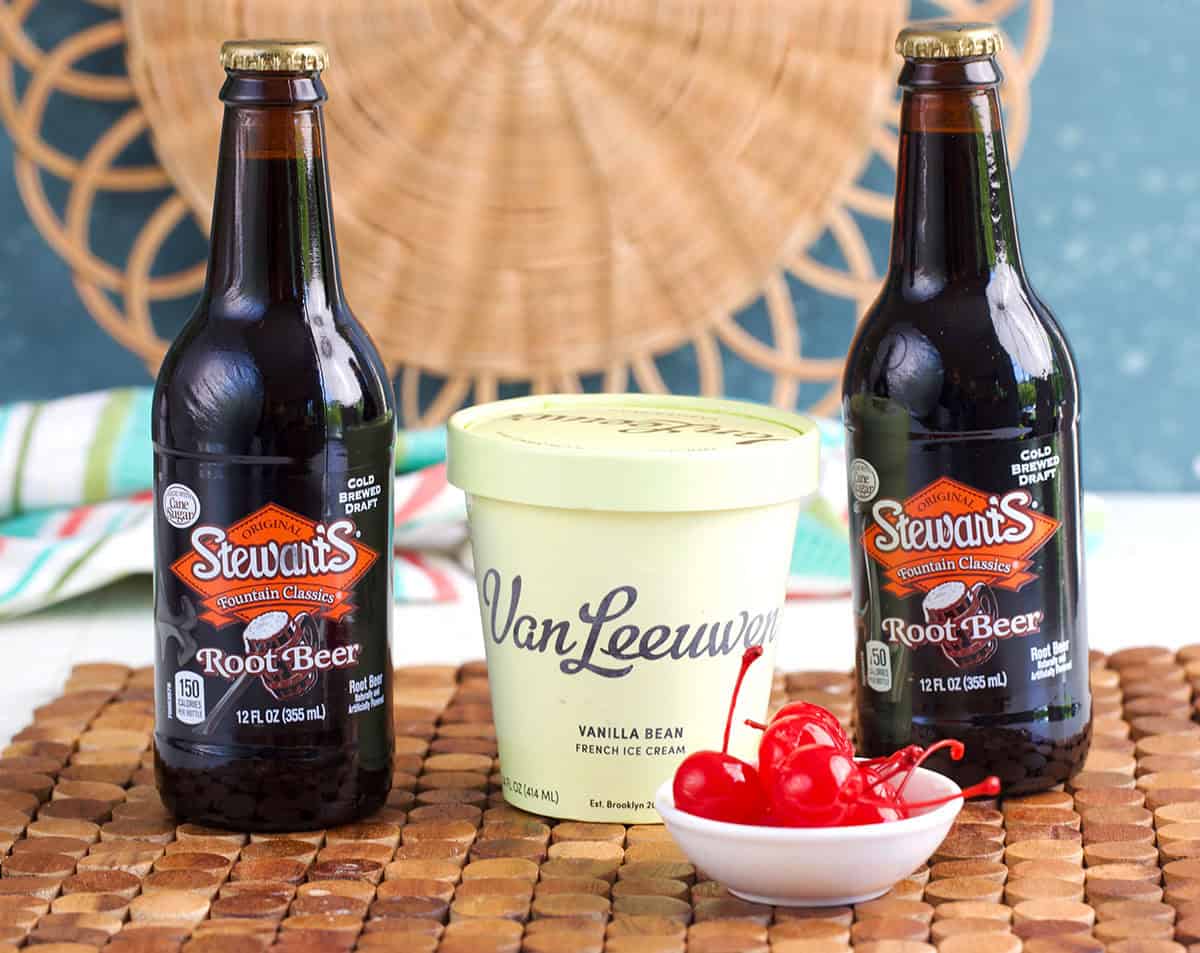Ingredients for root beer floats, bottled Stewarts root beer, vanleewan vanilla ice cream and cherries.