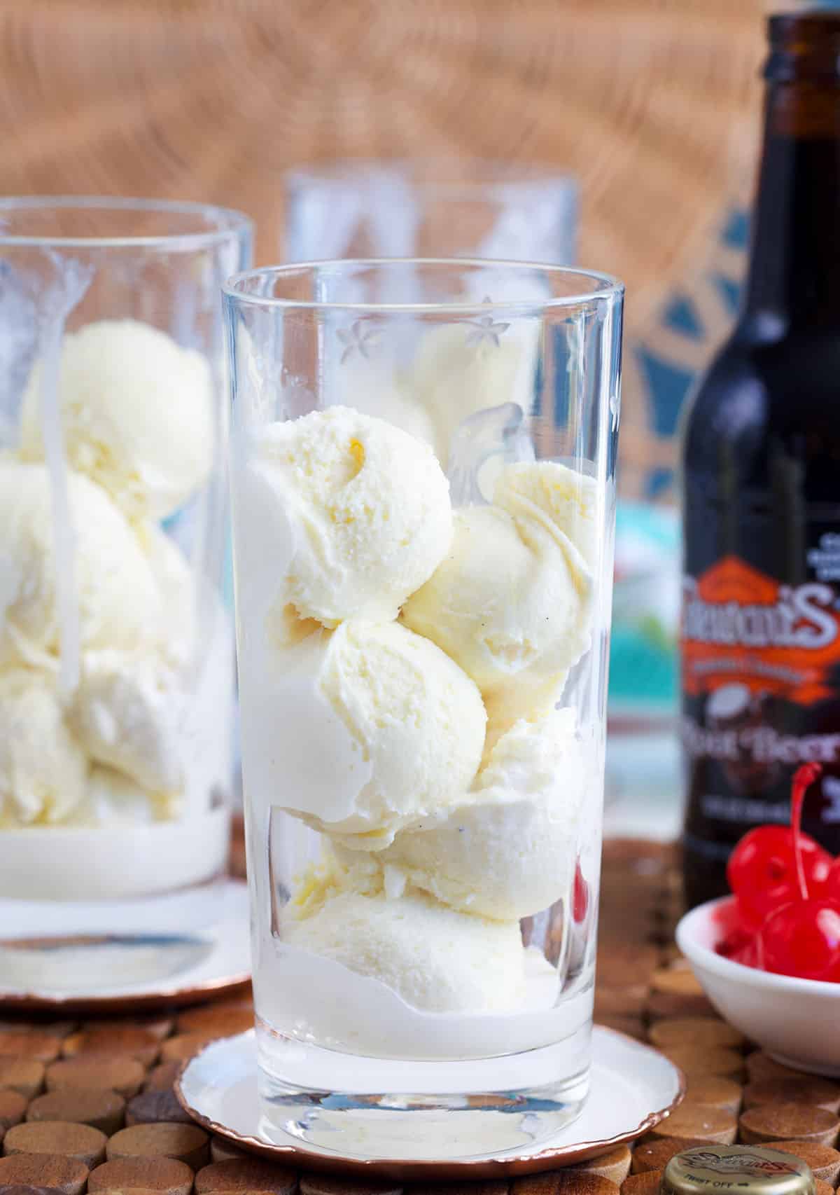 tall glass filled with vanilla ice cream scoops for root beer float