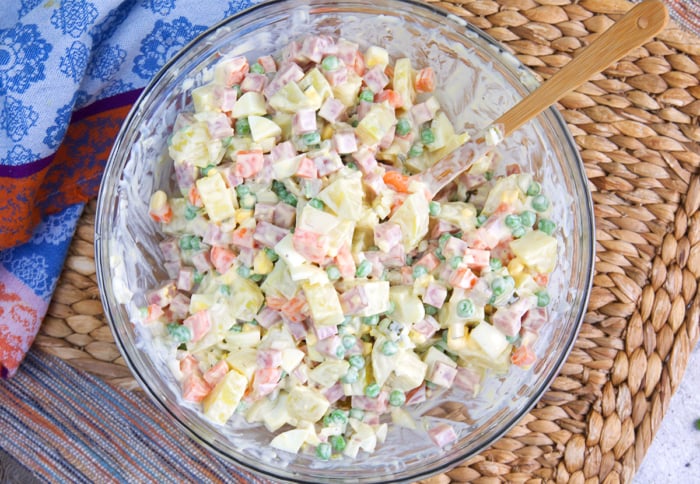 Russian salad combined in a bowl.