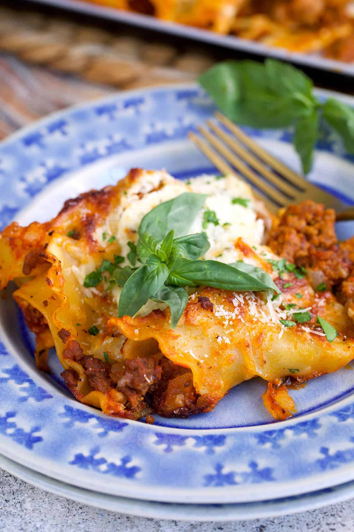 Serving of Sheet Pan Lasagna with ricotta and fresh basil