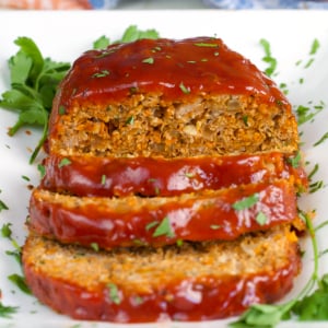 Turkey Meatloaf on a white platter sliced ready to serve.