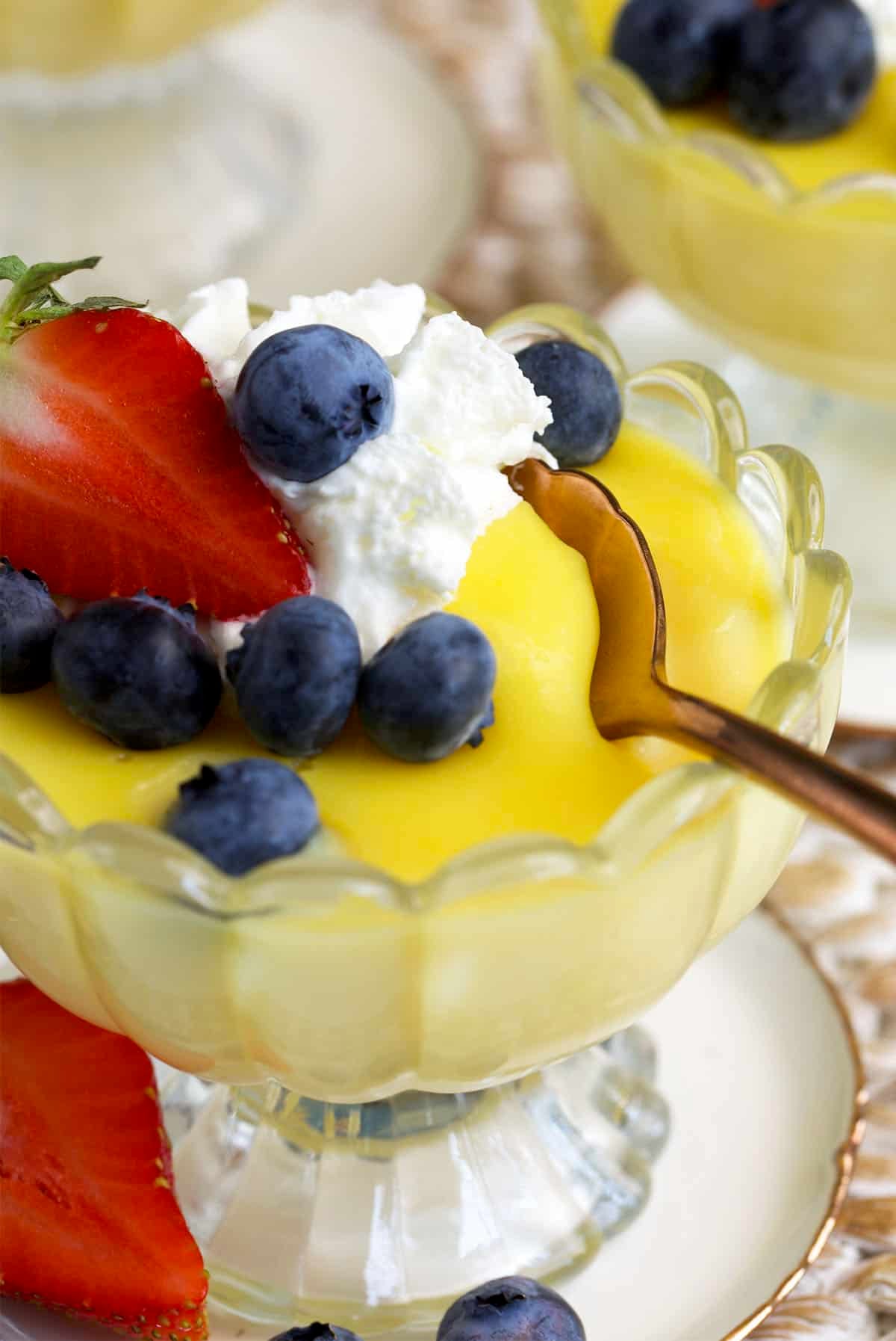 vanilla custard with a copper spoon in the dish.