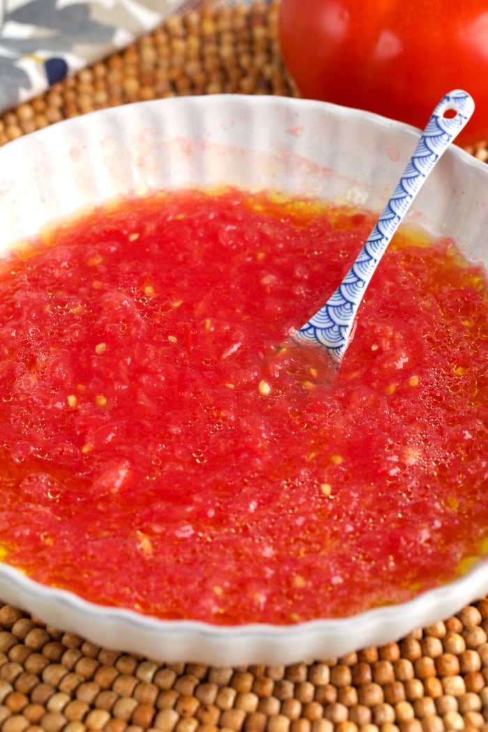 grated tomato in a white bowl for pan con tomate