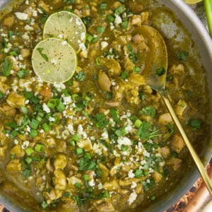 Chicken Chile Verde in a skillet with a serving spoon.