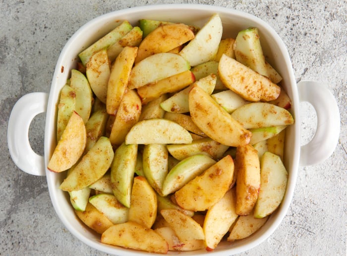 apples in a baking dish for apple crumble