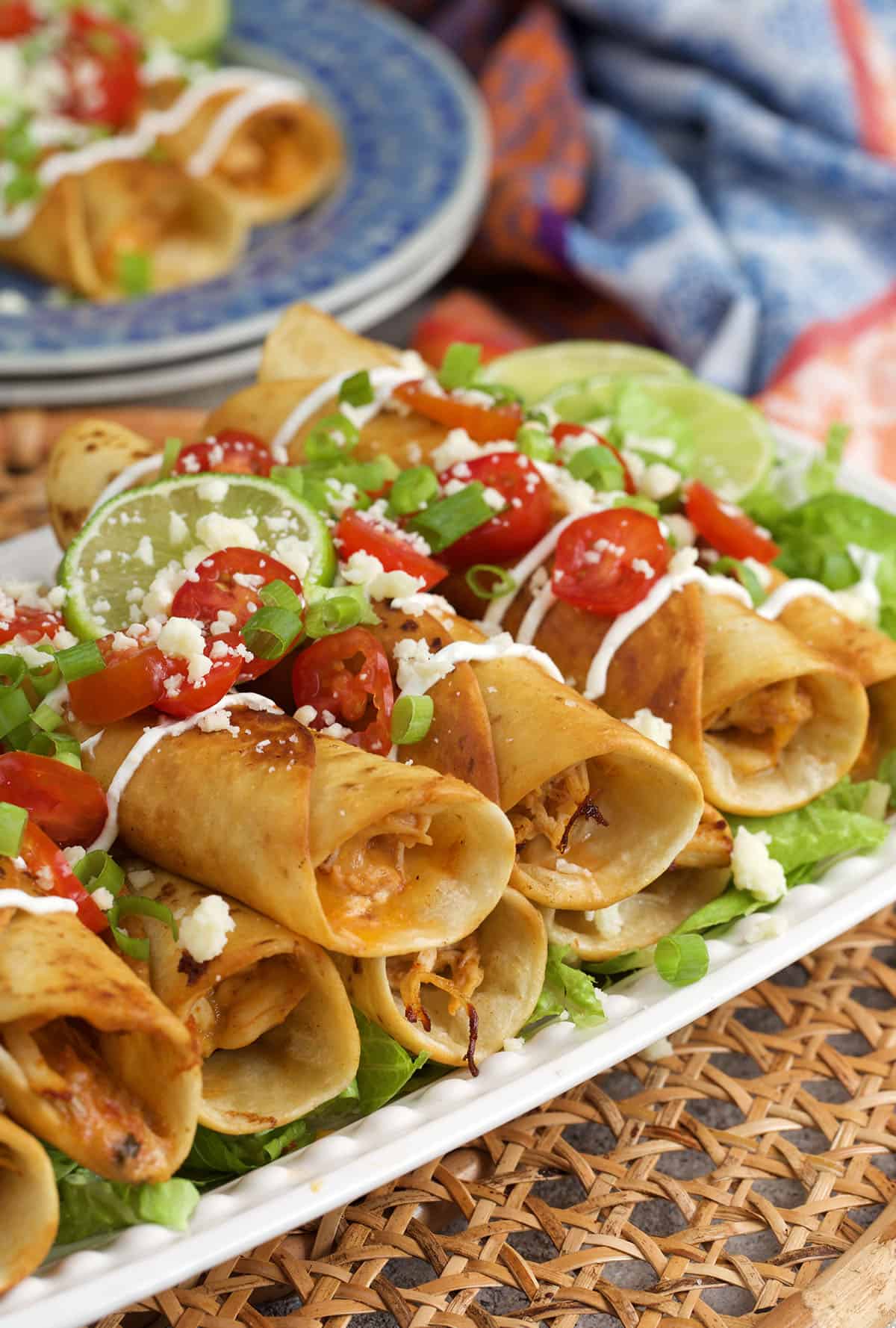 chicken flauta recipe stacked on a platter for serving.